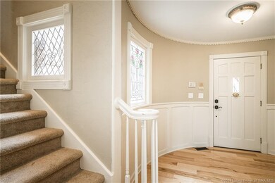 Welcoming foyer area with beautiful front door, st