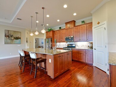Chef's kitchen with a Grand island, with designer 