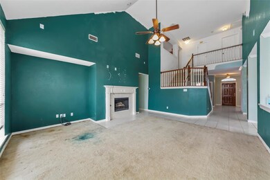 Unfurnished living room with light carpet, a tiled