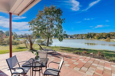 View of patio with a water view