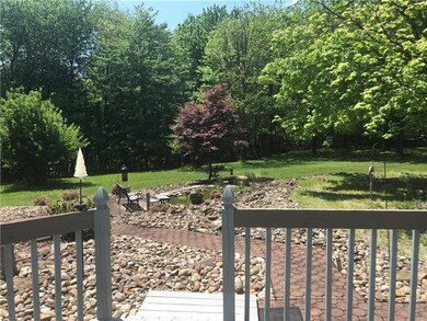 enjoy the view of the pond from the front porch