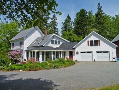 Paved driveway and lovely landscaped...