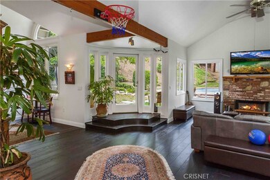 Unique and oversized family room, 15 ft ceilings, skylights, arched windows, portofino eng. wood floors, french doors and 2nd fireplace.