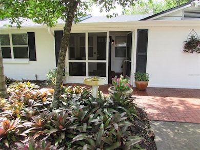 Screened porch leading to front door