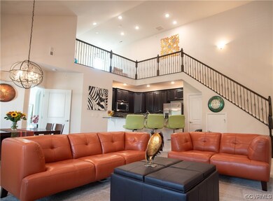 Expansive great room with dramatic  staircase