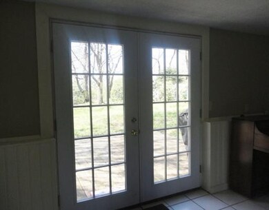 Family Room. French doors lead out to a small pati