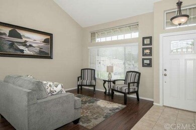 Elegant living room with upgraded flooring.  Notic
