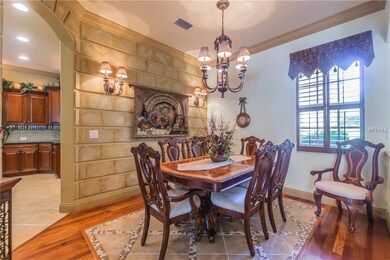 Lovey dining with stone wall feature and exquisite
