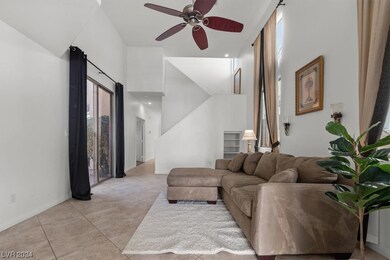 Living room is bright any airy with the tall.   Lo