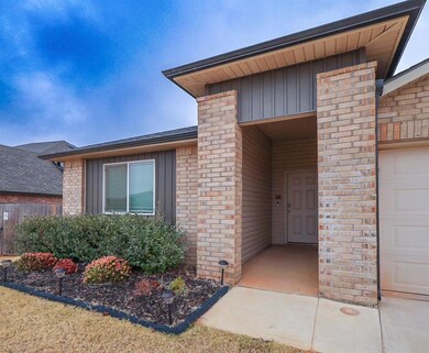 View of exterior entry with a garage