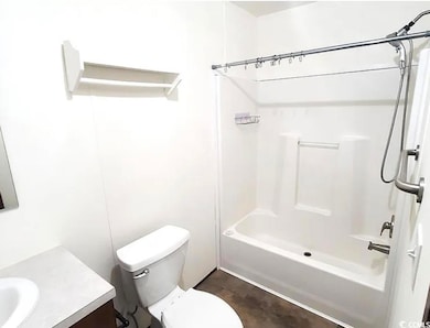 Bathroom featuring vanity and shower / bath combination