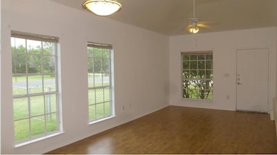 Spare room with plenty of natural light, wood fin