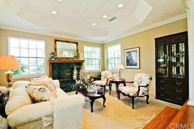 Step down into this elegant formal living room.