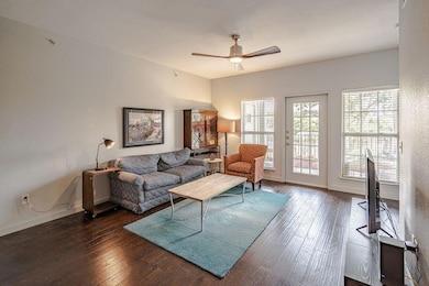 Living area with a ceiling fan and hardwood / woo