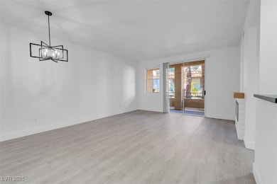 Living room with custom electric fireplace, and lu