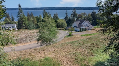 Lot 2 has beautiful, 180 degree siews of the Hood Canal, Kitsap Peninsula and Cascade Mountain Range. With cable and power on the street, access to Bridgehaven Water, and a community drain field connection.