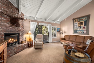 Living room with open beamed ceilings