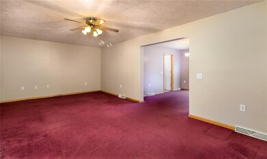 Large living room opens to the dining room and kit
