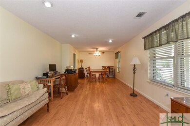 Living Room/Dining Room with beautiful wood lamina