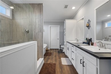 Full bathroom with double vanity, a walk in shower