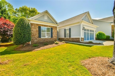 View of front of house featuring a shingled roof, 