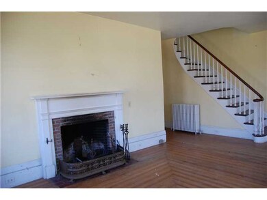Living Room. Stairwell in living room with parquet