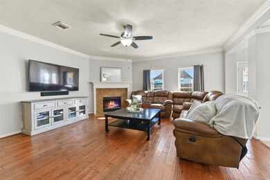 Continue straight ahead from the foyer into the heart of this home and you'll find a spacious and inviting family room anchored by a corner set gas or wood-burning fireplace, along with a pair of windows that frame fabulous pool views.