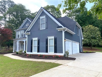View of front of home with concrete driveway and a