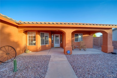 View of exterior entry with stucco siding