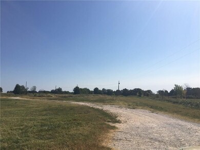 View of Property and South fence.  This driveway i