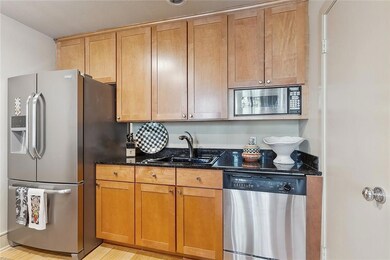 Kitchen with stainless appliances and pantry on th