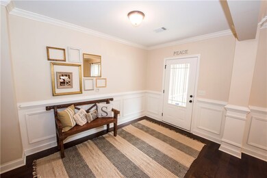 Foyer with picture frame moulding