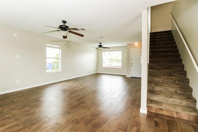 Spare room with ceiling fan and dark wood-type flooring