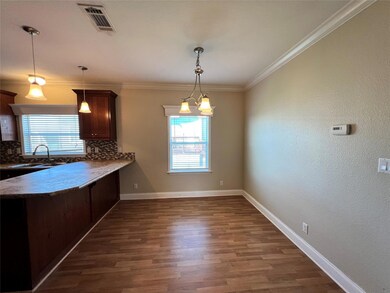 Kitchen featuring backsplash, healthy amount of n