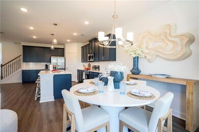 Dining space featuring crown molding, dark wood-ty