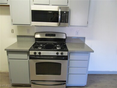 Kitchen featuring stainless steel appliances, base