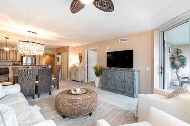 Living room with ceiling fan with notable chandeli