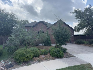 View of front of property featuring brick siding 