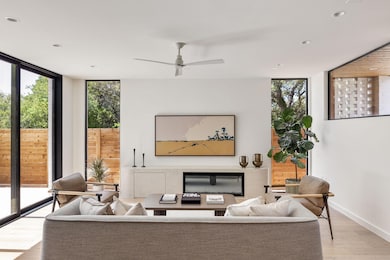 Living room featuring wood finished floors, expan
