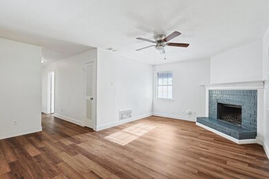 Unfurnished living room with a textured ceiling, a