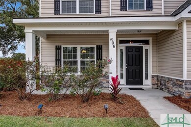 Freshly landscaped. Covered patio at front door.