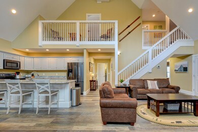 Open concept kitchen, living, dining.