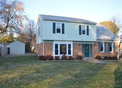 View of front of property with a front lawn and an