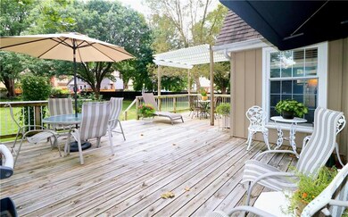 Large deck off kitchen with multiple sitting areas