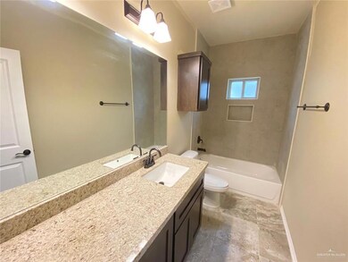 Full bath featuring toilet and vanity