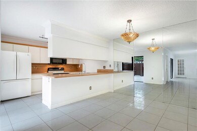 Kitchen open to dining/living room