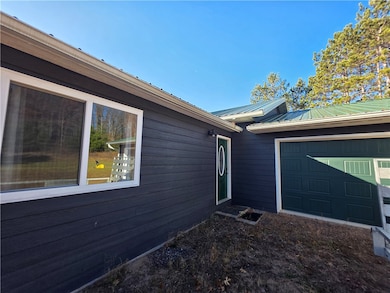 Main entrance of the home along with access through the garage.