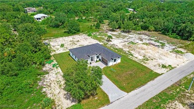 Aerial view of property and surrounding area with