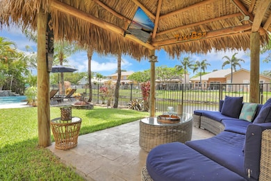 Relish in a tropical shaded tiki hut - feels like