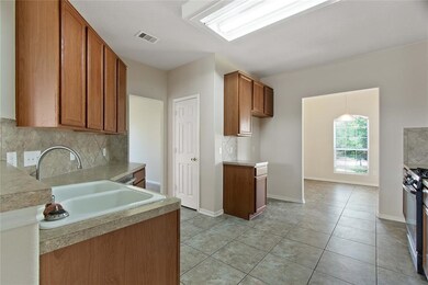 Kitchen bar leading to breakfast area and your own office or formal dining room to your left